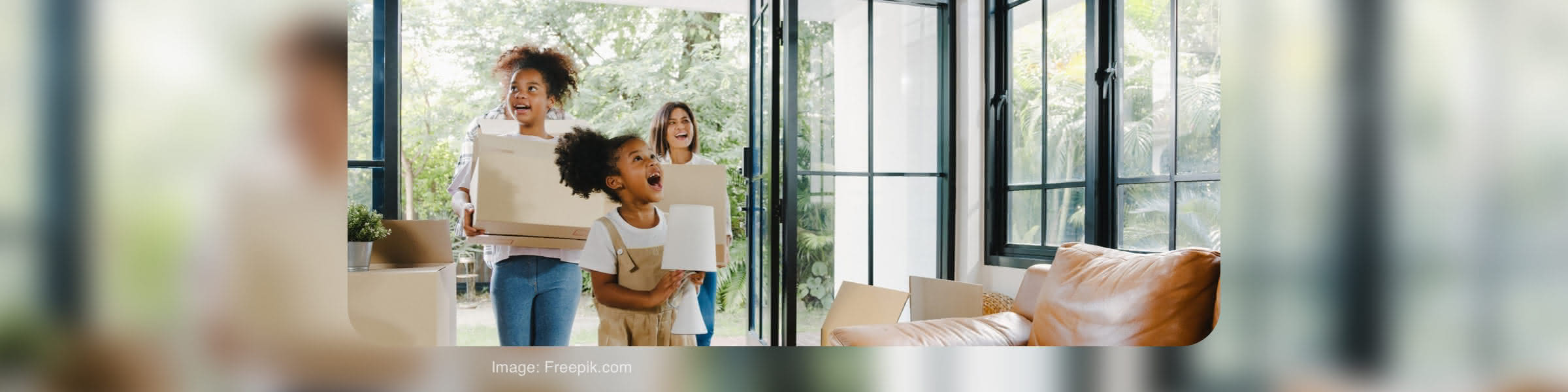 Family carrying moving boxes into a home for a tenant reference check